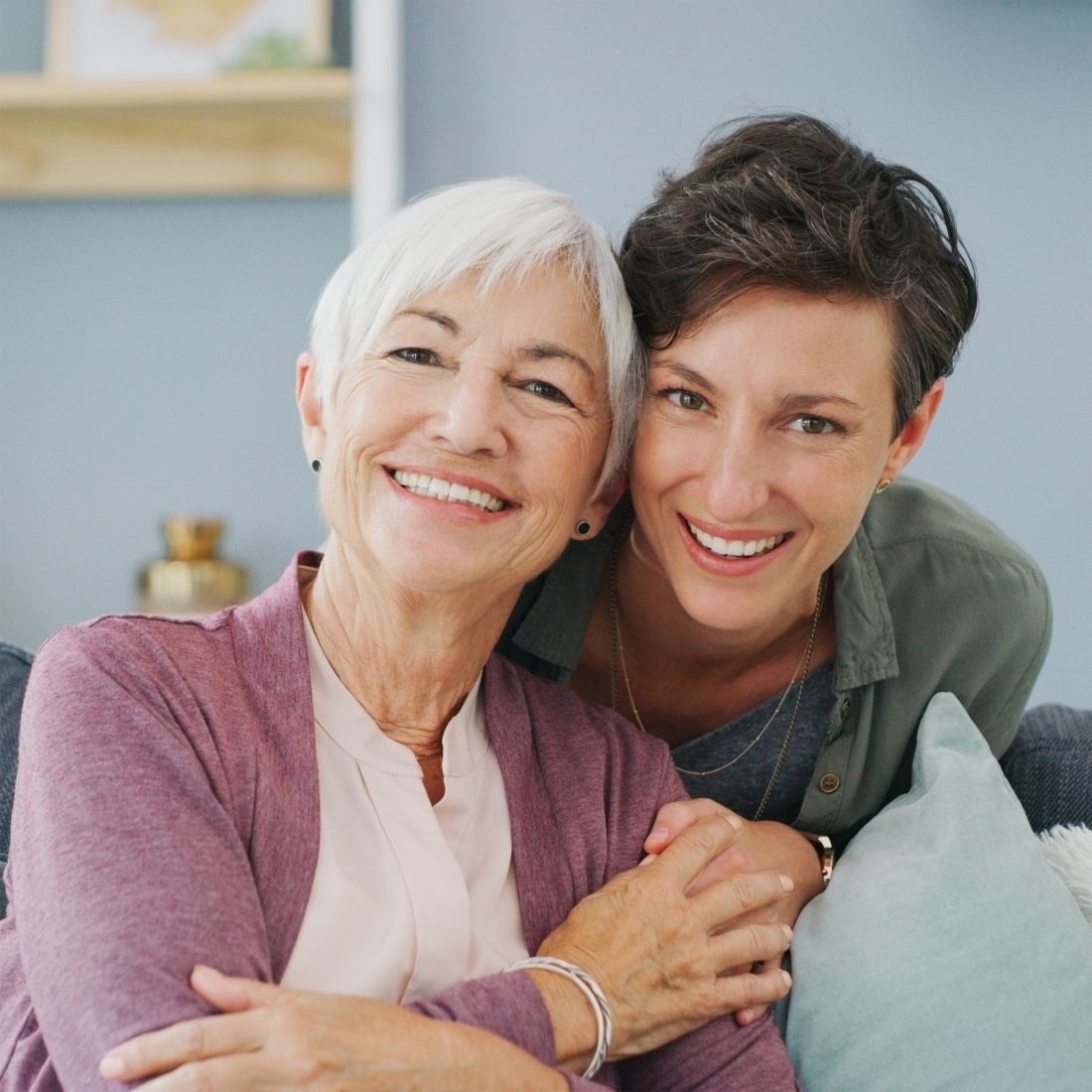 Senior woman, daughter and portrait in apartment with hug for family, love and support for retirement. Female people, happiness and together in house with care or kindness, mom with child for relax.